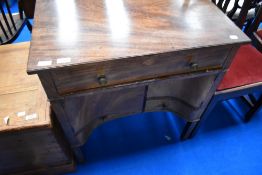 A 19th Century Regency style wash stand , having frieze drawer and recessed cupboard and drawer to