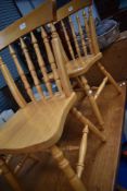 A set of four rubberwood kitchen chairs