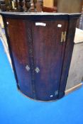 A 19th Century oak bow fronted corner cabinet, height approx. 101cm