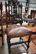 A 19th Century Carolean revival dining chair having 'green man' and foliate decoration to back