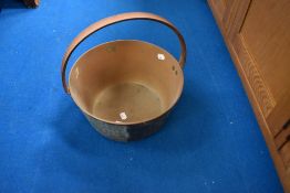 A vintage brass jam pan