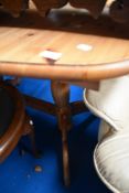 A modern pine oval dining table