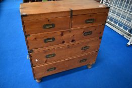 A reproduction campaign chest of two over three drawers, splits under second single drawer,