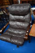 A vintage Ikea style easy chair , with brown leather cushion