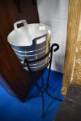 A modern ice bucket on stand