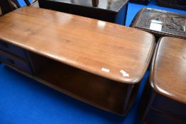 An Ercol dark stain coffee table, in the Pandora style with drawer storage under, approx. 125 x