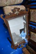 A 19th Century mahogany framed mirror having gilt work decoration and eagle, height approx 94cm