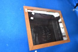 A golden oak frame wall mirror