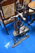 A traditional oak spinning wheel, in need of some repair , includes spares