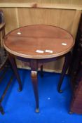 An early 20th Century mahogany occasional table having circular top and cabriole legs, diameter