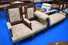 A Victorian mahogany framed salon suite, comprising chaise longue , gents and ladies easy chairs and