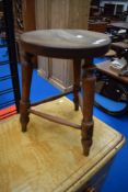 A traditional triform stool having circular top, height approx. 46cm