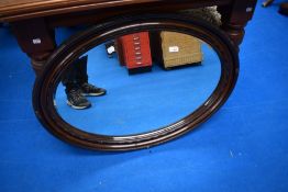 A 19th Century mahogany framed oval wall mirror