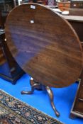 A 19th Century mahogany circular snap top table on triple splay legs, diameter approx. 86cm