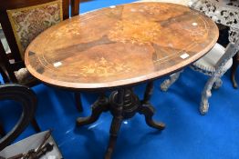 A Victorian inlaid occasional table of oval form, approx 92 x 53cm
