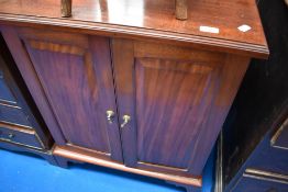 A mahogany two drawer side cabinet