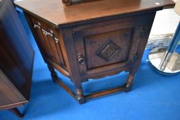 A priory style canted side cabinet