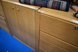 Three golden oak effect units, comprising bureau , cupboard and drawers, labelled Hulsta