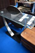 A modern stylised glass and chrome console table, approx. 122 x 46cm