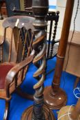 An early to mid 20th Century mahogany standard lamp and shade