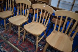 A set of four traditional beech kitchen chairs