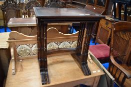 An early to mid 20th Century mahogany nest of three tables having bamboo style legs