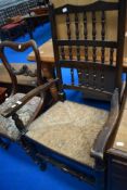 A traditional spindle back kitchen chair and a Victorian mahogany balloon back dining chair