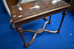 An Edwardian walnut side table