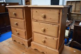 A pair of natural pine bedside chests
