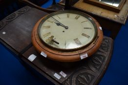 A station style wall clock, face worn