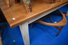 A traditional French style kitchen table having golden oak top and painted frame, approx. 200 x