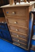 A modern pine narrow chest of six drawers, height approx. 122cm