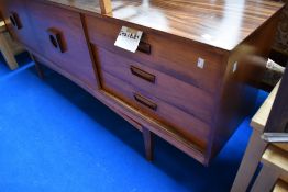 A vintage laminate rosewood EFFECT sideboard of stylised design, width approx. 183cm