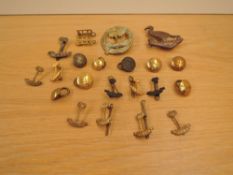 A collection of WAFF/RWAFF/Nigeria Regiment Badges and Buttons including WAFF Nigeria Regt Cap Badge