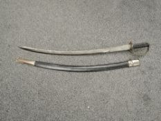 An Indian Calvary Sword, curved blade marked Made In India, wire and wood grip with metal guard