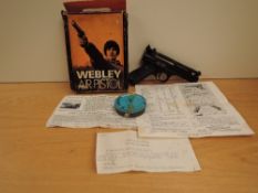 A Webley Premier .22 Air Pistol in original box withy paperwork and a box of pellets