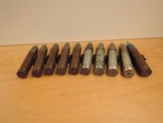 Ten Military Empty Shells, one numbered 30-550AA, each length 20cm on a metal belt