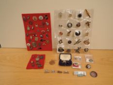 A collection of Military and other Badges including Silver The Kings Own x4, Silver ARP, Silver Rail