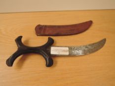 A Sudan Beja having wooden X Grip, blade length 19cm, overall 29cm, in decorated leather scabbard
