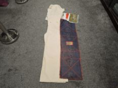 A set of White Canvass Overalls, large size along with three 50th Anniversary D-Day Tea Towels and a