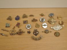 A small box of Military Badges and Sweetheart Brooches including RAF, Northumbria Volunteers,