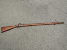 A 19th century Percussian Rifle, three rings, under lever trigger, blank lock plate, marks to barrel