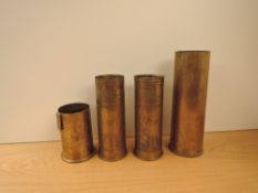 A pair of Trench Art Brass Shells dated 1915 & 1917 decorated with Cranes or Flamingo's height