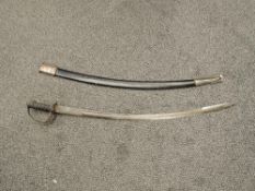 An Indian Calvary Sword having decorated curved blade, wood and wire grip with pierced guard,