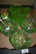 Six pretty 1920's green glass dessert bowls sod alongside a similar green glass water jug and a
