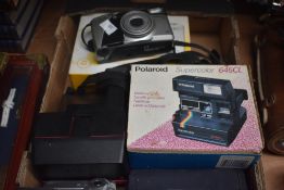 Three assorted vintage cameras, a Polaroid Supercolour 645 CL, A Kodak EasyShare C433 and a