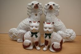 A pair of Staffordshire Pottery spaniels of traditional design 32cm, crazing and staining, sold