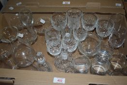 A selection of assorted plain, cut and etched drinking glasses.
