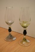 Two 20th Century decorative nosing glasses, having swirl design to the knopped stems and footed