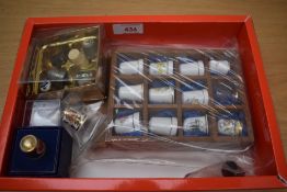 A small selection of assorted metal and ceramic thimbles including two Royal Crown Derby 'Imari'